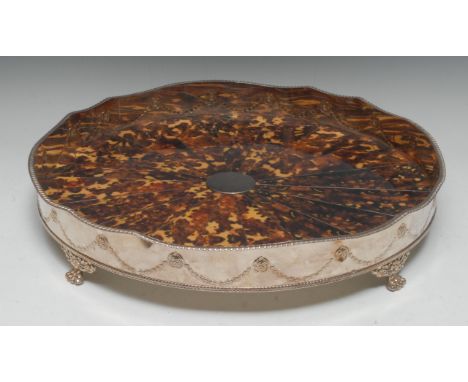 A large silver plated circular gallery tray, the sides embossed with oval masks and husk swags, the field with radiating faux