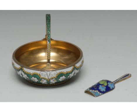 A Russian silver-gilt and cloisonné enamel swing handled basket, decorated in tones of green, white, black and yellow with fl