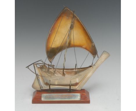 A Middle Eastern silver coloured metal model yacht, 23cm long, 7oz, wooden stand, cased