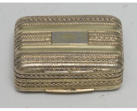 A George IV silver-gilt rounded rectangular vinaigrette, engine turned in bands, hinged cover enclosing a pierced grille, 3cm