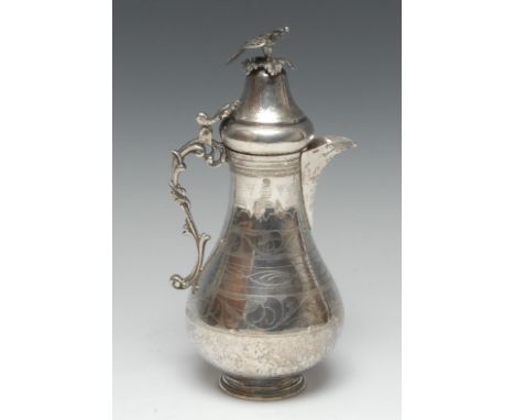 A Middle Eastern silver baluster coffee pot, of typical Turkish form, hinged lofty domed cover with bird finial, wriggle-work