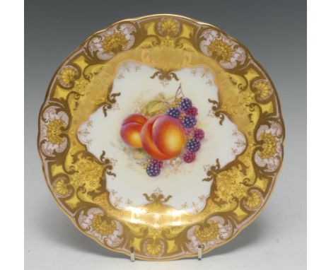 A Royal Worcester shaped circular cabinet plate, painted by John Freeman, signed, with ripe peaches and blackberries, scrolli