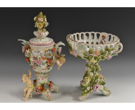 A Sitzendorf vase and cover, with cherubs, floral encrusted, mark in blue; a similar German porcelain comport (2)