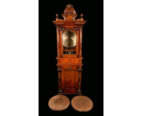 A 19th century walnut floor-standing coin operated penny-in-the-slot polyphon, vertical mechanism, the architectural case wit