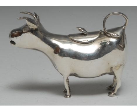 A 19th century Dutch silver cow creamer, in the manner of John Schuppe, hinged cover, 13.5cm long, import marks for London  1