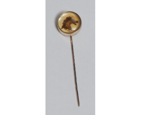 An Elizabeth II 9ct gold-mounted Essex rock crystal gentleman's novelty stick pin, inset with a sporting roundel of a race ho