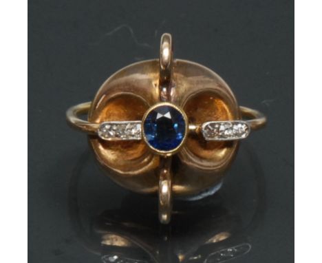 Rudolf Feldman, a contemporary modernist designed 14ct gold mounted sapphire and diamond swivel ring, the central oval cut sa