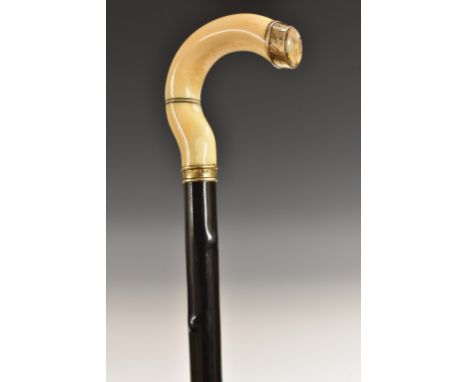 A late 19th/early 20th century South African gentleman's 22ct gold-mounted gold quartz, marine ivory and ebony walking stick,