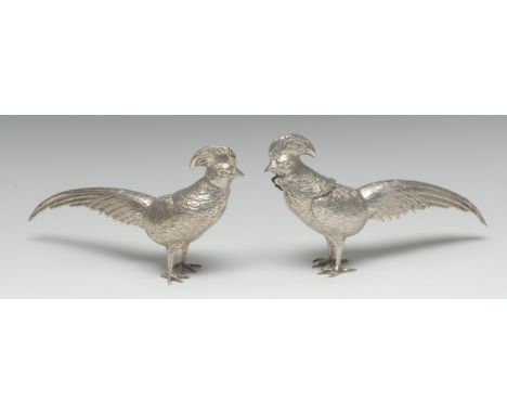 A pair of Continental silver novelty canisters, as exotic birds, each head detachable as a cover, 22cm long, marked 800, 11.5
