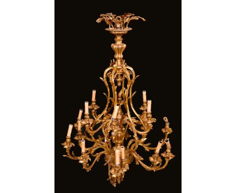 A Rococo design gilt metal eighteen light ceiling electrolier, cast throughout with scrolling acanthus, 134cm high, 95cm wide