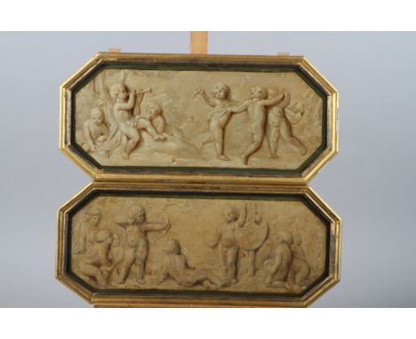 A pair of 19th century trompe-l'oeil oil on panels, putti, 6 1/2" high x 15 3/4" wide, in octagonal gilt framesCondition:Few 