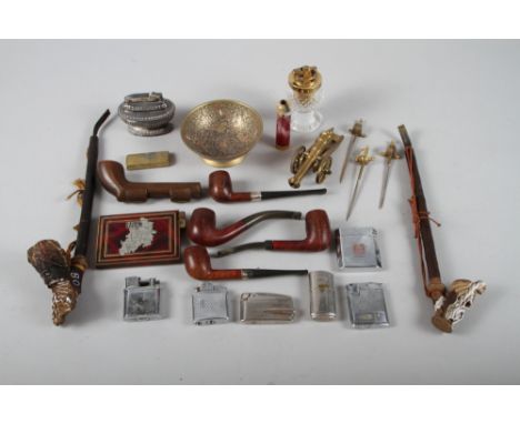 A late 19th century "Jacob" pipe, a similar skeleton pipe, five briar pipes, a carved hardwood pipe case and a collection of 