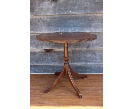 A mahogany low coffee table with tooled lined top, on 'X' frame supports, 36" wide x 16" deep x 16" high, a mahogany and band