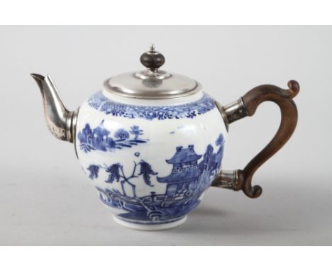 A 19th century Chinese blue and white teapot with white metal mounts, decorated landscape with buildings, 5 1/2" high 