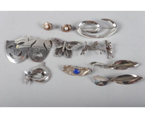 A selection of silver and white metal jewellery, including a marcasite horse brooch, a pair of silver, gold and pearl earring