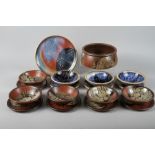 C P: a set of five redware bowls with resist glazed decoration, three similar bowls, 6 1/2" dia,
