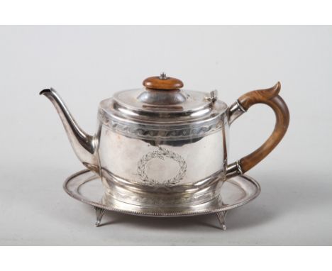 A Georgian style teapot, 8.9oz troy approx, a matched silver plated teapot stand and a Continental white metal mounted cut gl