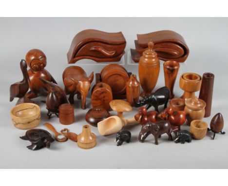 An assortment of treen, including an ebony model of a rhinoceros, 3" high, a model of a tortoise and various vases 