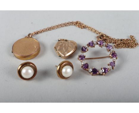 A 9ct gold circular locket, a 9ct gold heart-shaped locket, a pair of yellow metal and pearl ear studs and a 9ct gold amethys