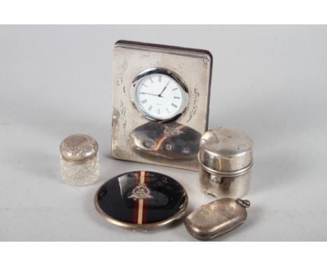 A silver double sovereign case, a travelling inkwell, a silver cased clock, 4 1/2" high, a compact and a dressing table jar 