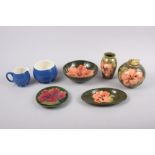 A Moorcroft "Hibiscus" pattern shallow bowl, 5 3/4" dia, a similar table cigarette lighter, a