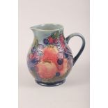 A Walter Moorcroft "Pomegranate" pattern baluster jug, 6" high