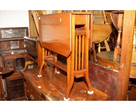 A mahogany gate leg octagonal table with slatted sides, on splayed supports, 26 1/2" wide 