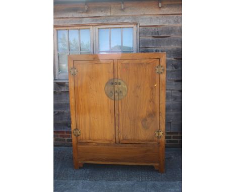 A Korean wedding cabinet with door enclosed two drawers, on stile and bracket supports, 49" wide x 62" high 