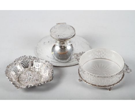 A silver capstan inkwell, a Victorian silver bonbon dish with pierced and embossed decoration and a silver butter dish with f