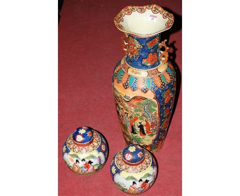 A large reproduction floor vase, in the Japanese Satsuma style, the central panel decorated with figures, pagoda and foliage,