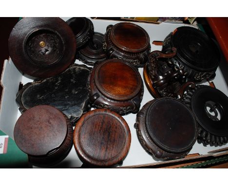 An early 20th century Chinese hardwood vase stand, of circular form, having fret-carved frieze on scrolling supports; togethe