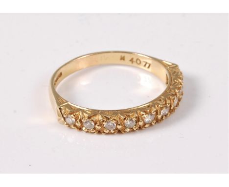 An 18ct diamond half hoop ring, total estimated weight of diamonds approx. 0.18cts, Sheffield 2004, size Q,  (4.2g)