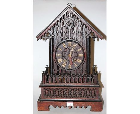 A late 19th century Continental oak cased cuckoo clock, of architectural outline, having applied Roman numerals and eight day