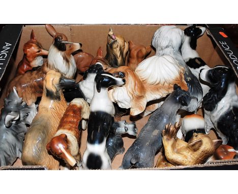 A box of assorted ceramic dog ornaments, mainly being Coopercraft examples to include Old English sheepdog, spaniel, collie e