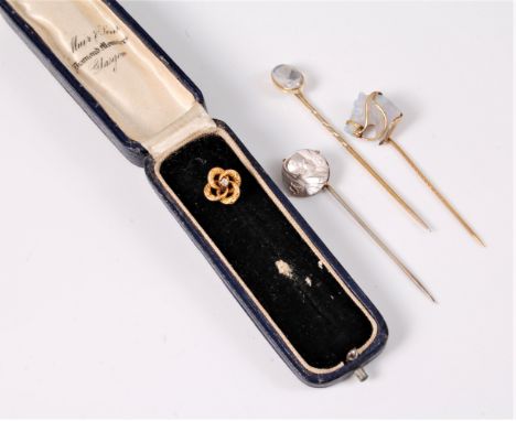 Four stick pins to include a moonstone, an old cut diamond, a horse head and Napoleon (4)   Condition Report / Extra Informat