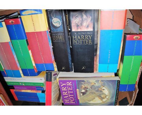A box of J K Rowling Harry Potter books, hard and paperback examples to include some first editions