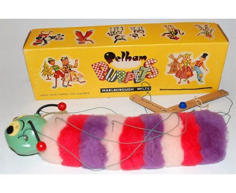 A boxed Pelham Standard caterpillar puppet 