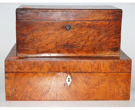 A Victorian walnut tea caddy, of typical rectangular form, the hinged lid revealing twin compartmented interior (one lid miss