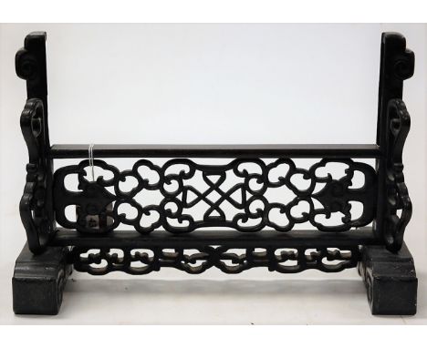 An early 20th century Chinese hardwood table screen stand, having all-over fret-carved decoration, w.32cm   Condition Report 