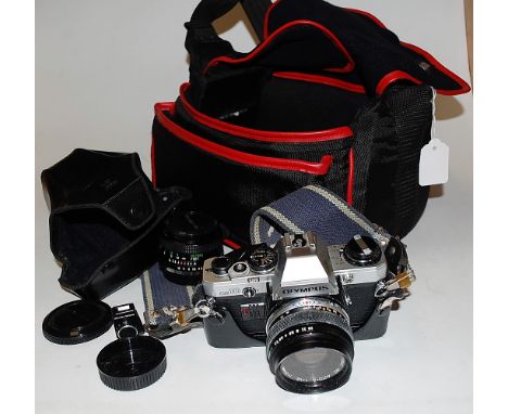 An Olympus OM10 camera, with spare lens and Olympus bag 