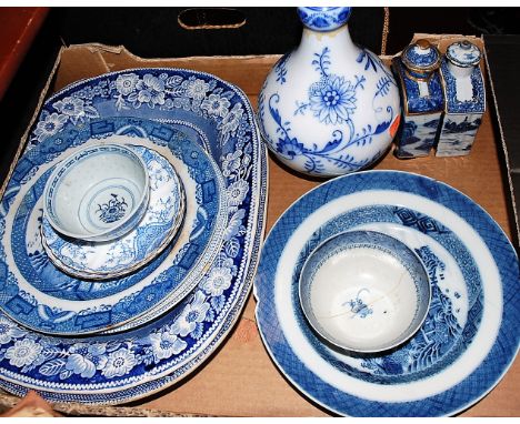 Two Chinese export stoneware blue and white vases and covers, each of slab-sided rectangular form, decorated with pagodas ami