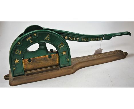 A green painted and brass mounted Star Tobacco 'save the tags' manual operated table-top tobacco cutter, numbered verso 5837,