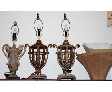 A pair of large painted pressed metal and crackle glazed table lamp bases, each with acanthus leaf decoration and light brown