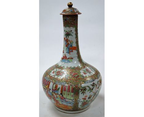 A 19th century Chinese Canton famille rose vase and cover, of mallet form, the body decorated with seated figures in an inter