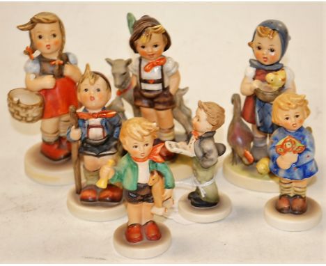 A Goebel figure 'Little Goatherder', printed mark verso and impressed 200/0; together with a six various other Goebel figures
