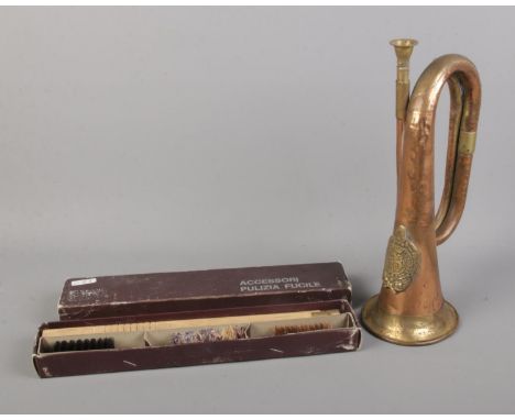 An Argyll and Sutherland Bugle horn along with boxed cleaning kit.  