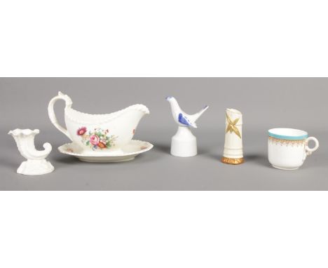 A small collection of Royal Worcester ceramics. Includes 1885 gilt decorated teacup, 1049 bamboo vase and pie funnel.  Small 