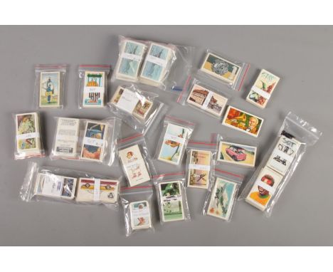 A quantity of collectors cards, mainly full sets. Includes Glengettie Modern Transport, Wills Air Raid Precautions, Titbits m