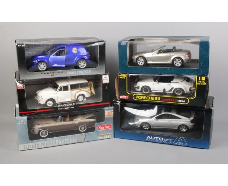 Six boxed 1/18 scale diecast cars including Sunstar Mercedes Benz 220SE, Anso Porsche 911, Auto Art Chrysler Panel Cruiser, e