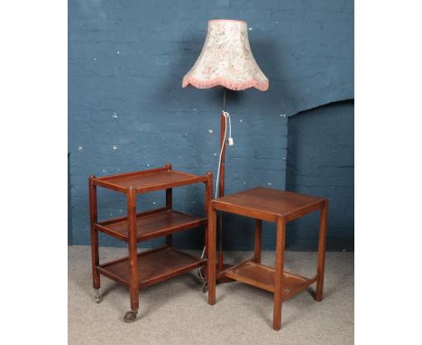 A three tier tea trolley, along with similar table and standard lamp.  